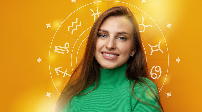 Person smiling in front of astrology zodiac signs on orange backdrop