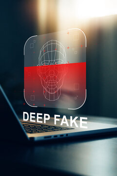 Deep fake technology displayed on a laptop screen in a dimly lit room