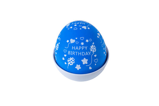 Hand holding a blue egg shaped kitchen timer isolated on white background