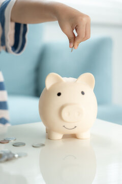 Save money. children putting coin for saving. wealth, Finance, insurance, investment, education, future, plan life, learn, banking, family, health, health and accident insurance.