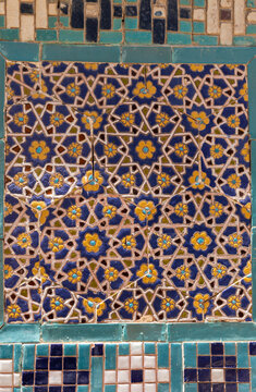 yellow and blue floral ceramic mosaic wall, old ornament pattern background texture in Samarkand Uzbekistan