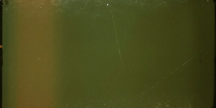 Old vintage 16mm film leader frame with green hue and light burn green background analog texture old movie