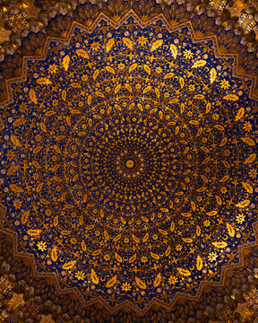 luxury circle ornament on blue and gold Islamic ceiling with intricate floral texture, birds and geometric patterns, traditional Uzbek architectural interior background