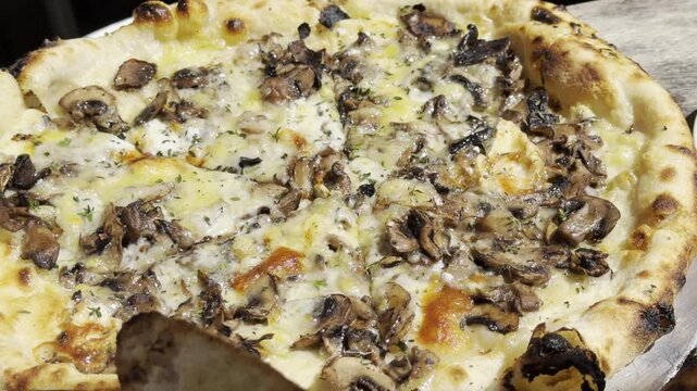 Mushroom pizza at Gjelina, American Restaurant.  Venice is a neighborhood of the City of Los Angeles within the Westside region of Los Angeles County, California, United States.