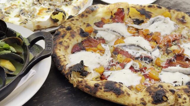 Pomodoro, Tomato Pizza and Black Mussels & Asari Clam at Gjelina, American Restaurant.  Venice is a neighborhood of the City of Los Angeles within the Westside region of Los Angeles County, California