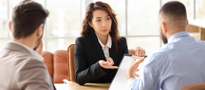 Job interview and recruitment process, professional woman interviewing candidates in a modern office with diverse team members and corporate hiring