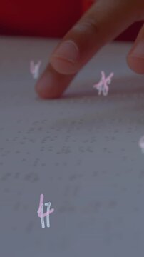 Animation of numbers over caucasian schoolgirl reading braille