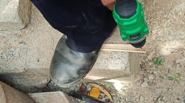 Drilling Small Hole in Bamboo Cane Using Mini Rotary Power Tool Close Up