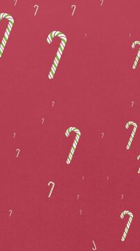 Animation of christmas candies falling on red background