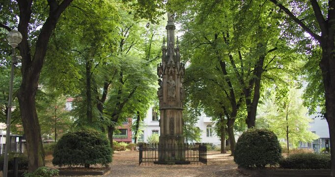 City park Mariensaule Marian Column Cologne Germany features a historic religious statue surrounded by urban scenery and cultural landmarks in a European travel destination.