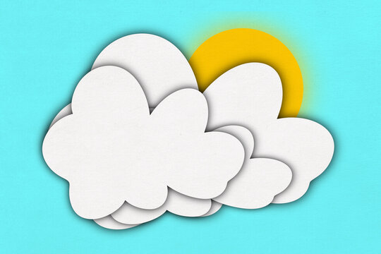 White layered clouds with sun illustration on blue background