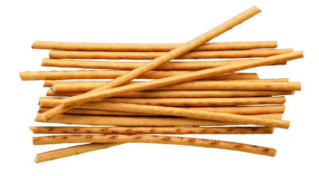 Pile of salted pretzel sticks cut out on a white background. Top view