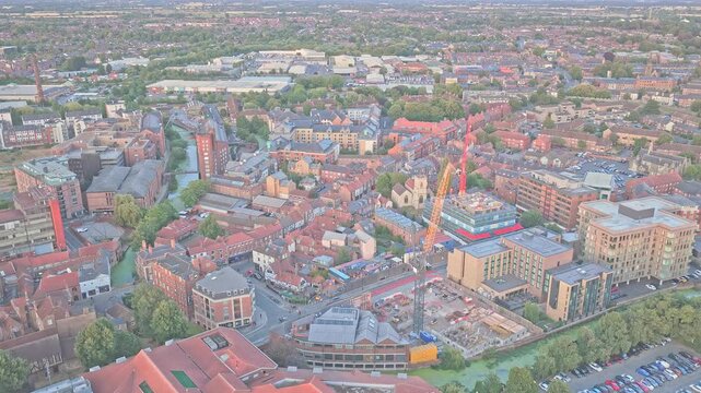 York Castle Gateway extends across the historic city centre in England, with Castle Museum, dense brick buildings and a major development site visible near the River Foss, drone forward flyover.