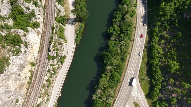Drone Shot of Ovcar Banja, Serbia. West Morava River, Road Traffic and Railway on Sunny Summer Day