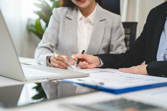 Financial consult planning investor asses and present to client, Close up shot client and advisor review investment strategy in the office.
