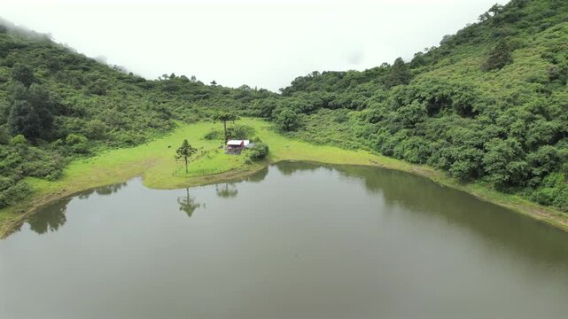 4K drone aerial view of Yala Provincial Park in Jujuy, Argentina. Misty mountain lakes surrounded by lush Yungas forests and dense green vegetation in a spectacular Andean landscape.