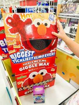 Tickle Me Elmo Giggle Max toy boxes stacked on a store display shelf. - Auburn WA USA - August,21 2026