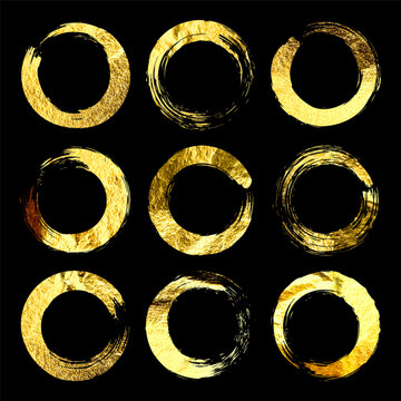 Golden grunge circles, brush strokes, lines, ink smudges, hand-drawn scribble shapes. Handmade sketchy marks, acrylic stains, charcoal streaks. Paint textures, dry brush effect. Vector illustration