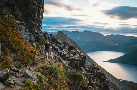 Athlete running on a rugged mountain trail