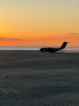 A400M take off roll on a beach at sunset