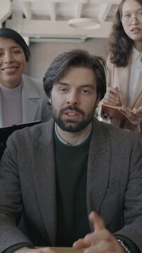 Portrait of people multiethnic group making online video call from office talking looking at camera discussing business. Distance communication and virtual meeting concept.