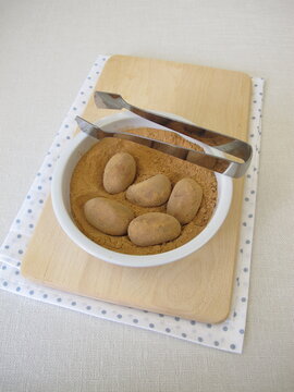 Homemade marzipan potatoes or marzipan eggs with low-histamine carob powder as a substitute for cocoa