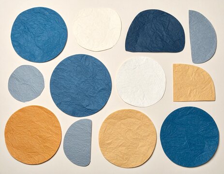 Abstract layout of textured paper cutouts in circle and semicircle shapes