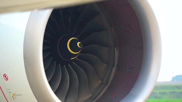 Detailed close up shot of commercial airliner jet engine turbofan blades and spinner cone preflight inspection aircraft mechanical engineering concept stock footage