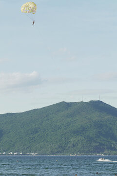 Parasailing over the sea. Da Nang coast. Active leisure.