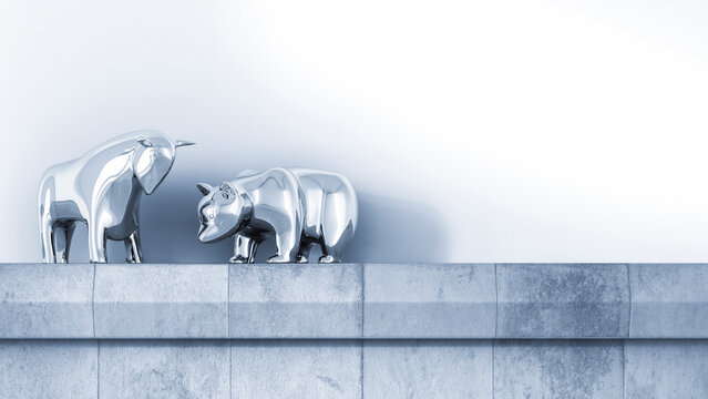 Bull and bear standing on ledge