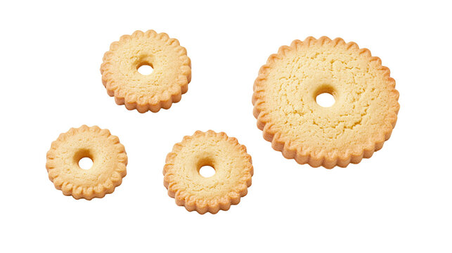 Four round scalloped butter cookies with central holes of varying sizes