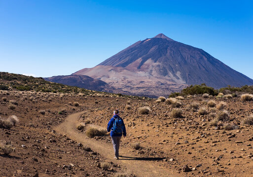 Spain, Canary Islands, Tenerife, Roques de Garcia, Mount Teide, Teide National Park, Female hiker on hiking trail Ruta Arenas Negras