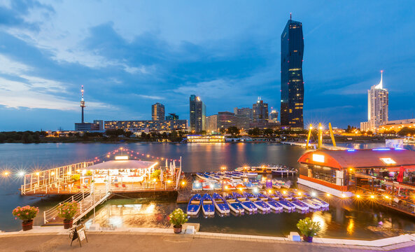 Austria, Vienna, Sunken City, Donau City, Danube River and DC Tower 1 in the evening