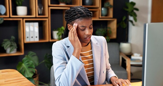 Massage, headache and business woman in office with pressure, crisis and overworked for advertising. Creative, computer and African person with migraine, pain and fatigue for brand management career
