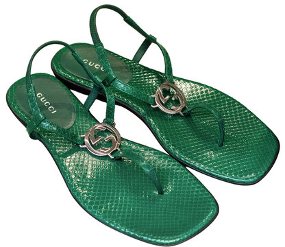 Luxury women&rsquo;s green python-skin thong sandals with a silver Gucci GG logo.Milan - Italy,01 September 2026