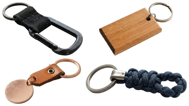 A set of assorted keychain accessories in woven, wood, metal, and leather styles on white.