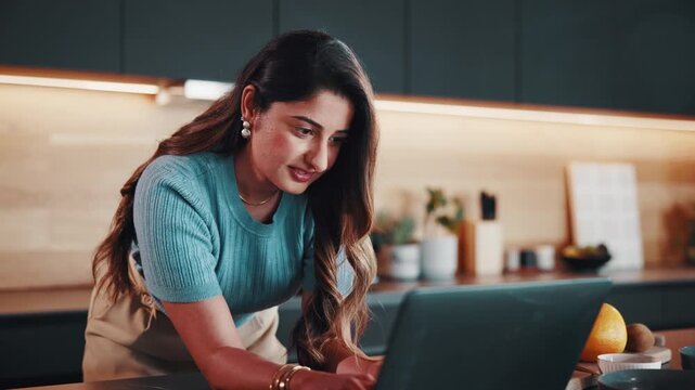 Happy woman, laptop and typing in home for remote work, notes or article with editing and productivity. Freelancer, tech and writing email for feedback with laugh, proofreading and creative report
