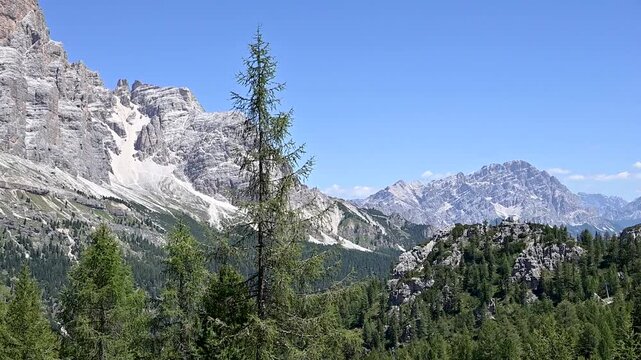 Iconic, dreamlike Dolomites. The Tofane and the Five Towers in summer. From hiking to climbing.