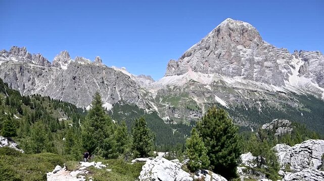 Iconic, dreamlike Dolomites. The Tofane and the Five Towers in summer. From hiking to climbing.
