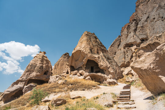 Stone path leading through rock-cut caves at Selime Monastery, Cappadocia