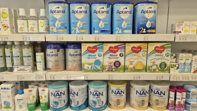Store shelves stocked with Aptamil, Milumil, and NAN baby formula cans and boxes. Picture taken on September 1, 2026 in Bucharest, Romania.