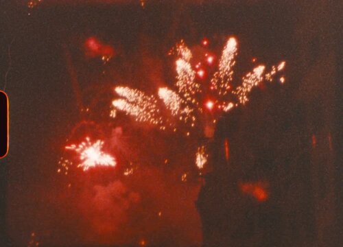 Vintage Super 8 Fireworks Exploding Over Night Sky