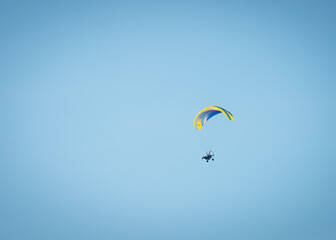 Sportsman flying with motorglider through dark clouds enjoying adrenaline © Ewald Fröch