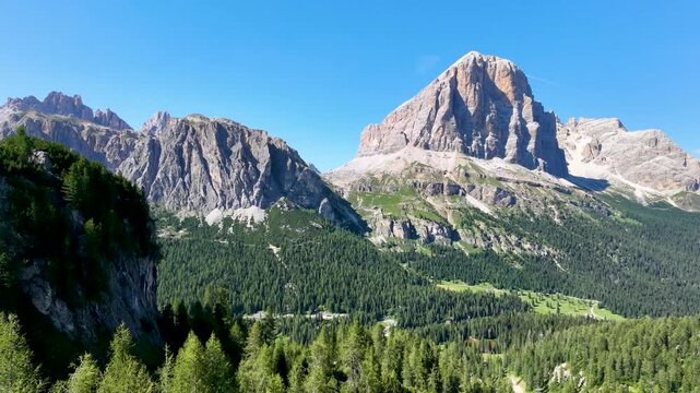 Iconic, dreamlike Dolomites. The Tofane and the Five Towers in summer. From hiking to climbing.