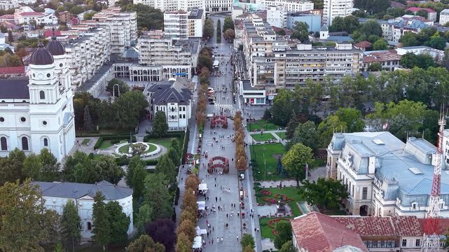 Aerial drone view of Bulevardul Stefan cel Mare in Iasi, Romania, showing the historic city center, pedestrian boulevard, parks and surrounding buildings
