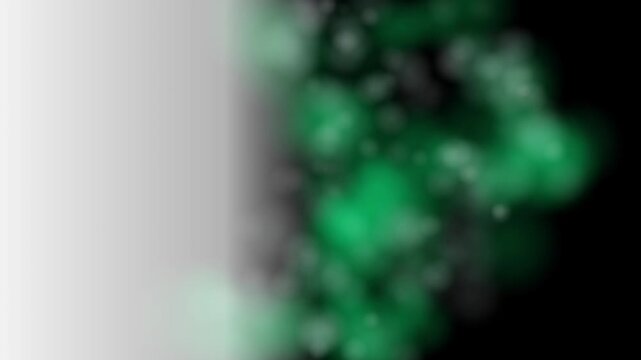 Abstract green bokeh particles floating against a dark background with a soft white gradient