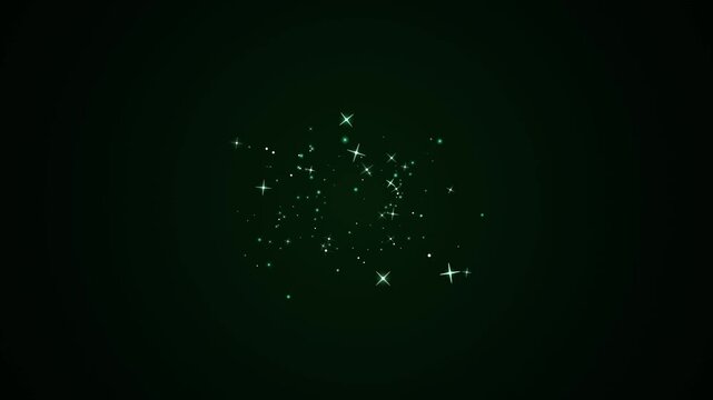 Emerald green sparkling particles float and shimmer on a dark background creating a magical