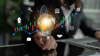 Business Innovation Concept with Light Bulb and Graphs Showing Growth and Success in Digital Economy and Strategy Development. Sentient. © InfiniteFlow