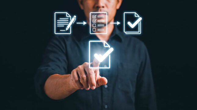 Businessman working with a digital workflow icon and flowchart, quality assurance, and business process management concept