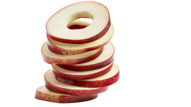 Stacked fresh red apple slices with circular holes in the center